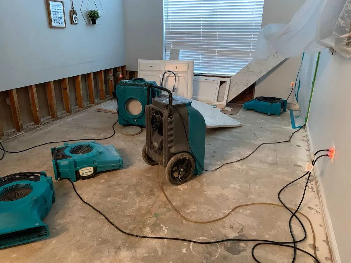 Dehumidifier in flood-cut room for Water Damage Restoration in Lacombe